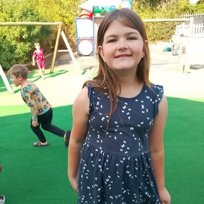 Portrait of a smiling girl on the playground